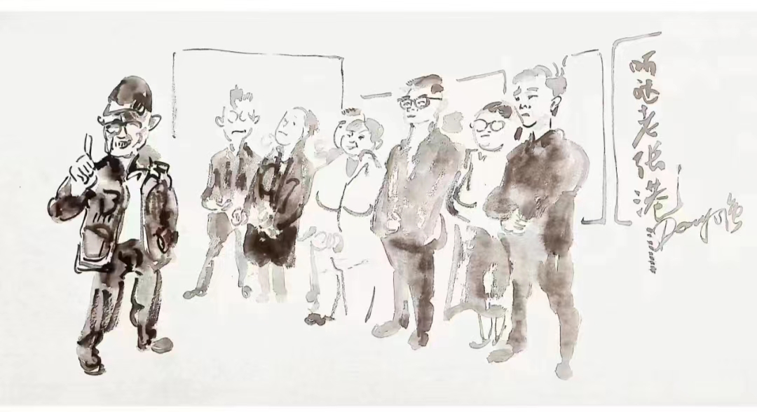 益陽(yáng)籍畫(huà)家在“僑界領(lǐng)袖張國(guó)基墨跡展”現(xiàn)場(chǎng)作漫畫(huà)